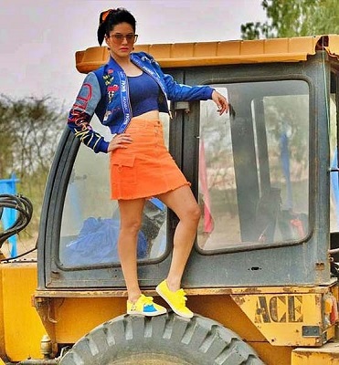 Actress Sunny Leone atop a JCB Excavator.Photo:Instagram